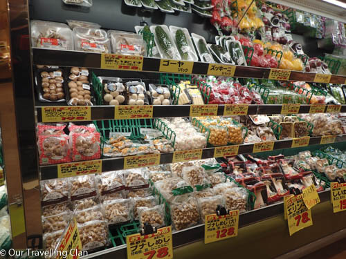 supermarket shelves with plastic packaged food